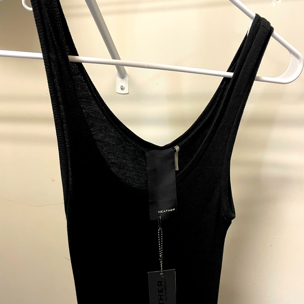 Slim black stretchy dress. Awesome for the beach